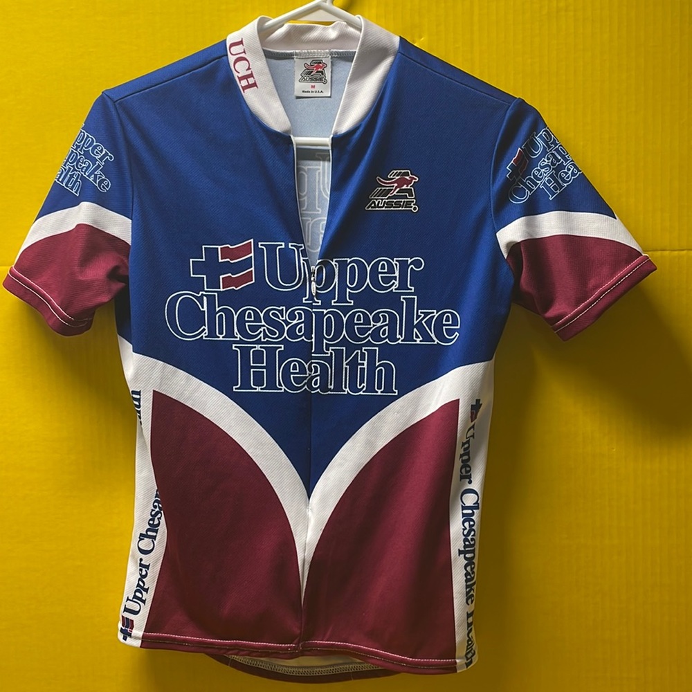 Aussie Apparel short sleeve bike shirt, size medium. Zipper in front/pockets